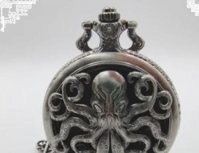 METAL POCKET DICE CASE WITH POLYHEDRAL MINI METAL DICE - CTHULHU SILVER IN A BLACK SUEDECLOTH BAG
